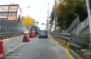 1352914298_car_avoids_outofcontrol_truck.gif